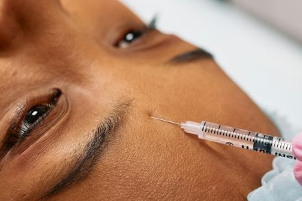 Injecting Person's Forehead