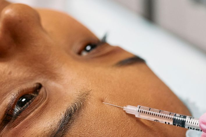 Injecting Person's Forehead